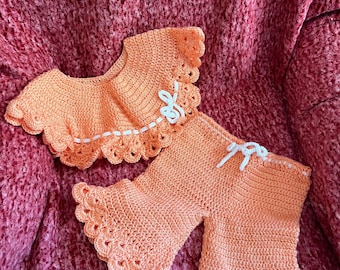 Crocheted girls 2 piece outfit, crop top and bell bottom pants, size 6-12 months, peach with white trim