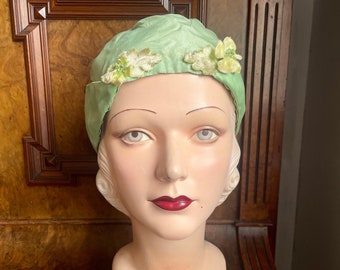 1920s mint green silk cap in taffeta and satin with delightful little velvet flowers and leaves. To fit  21" to 22” head (small to medium)