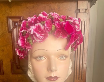 Shocking pink early 1960s all-over-flowers hat with cerise and white carnations and velvet bow