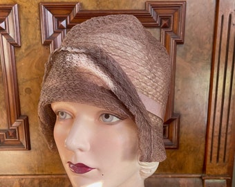 Stunning sheer 'straw' cloche in a delicious shade of pinkish taupe. New Old Stock with tags, size 21"