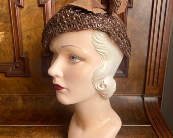 1930s beautiful asymmetrical brown celluloid and grosgrain hat original new with tags. Size 21 to 22” head - small to medium