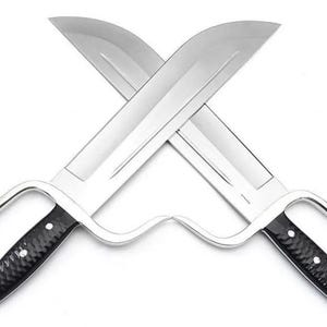 May include: Two crossed, shiny silver butterfly swords with black textured handles. The blades are wide and curved, and the handles have a finger loop design. The swords are displayed against a white background.