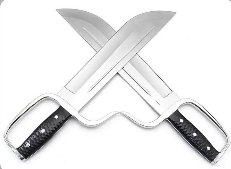 May include: Two crossed, shiny silver butterfly swords with black textured handles. The blades are wide and curved, and the handles have a finger loop design. The swords are displayed against a white background.