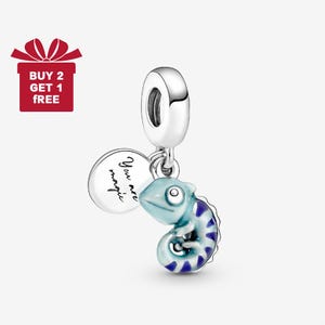 May include: A silver charm with a light blue chameleon design and a round charm that says "You are magic". The chameleon has dark blue stripes. A red gift box with the text "BUY 2 GET 1 FREE" is in the upper left corner.