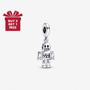May include: A silver robot charm with a round top and a small robot figure. The robot has a square head, body, and legs, with a zigzag design on its chest. A red gift box with the text "BUY 2 GET 1 FREE" is in the upper left corner.