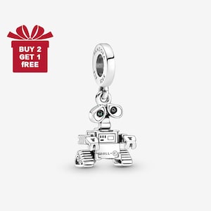 May include: A silver-colored charm featuring the WALL-E robot character. The charm has a round top with the brand name and a small robot figure with detailed features. The image also includes a red gift box with the text "BUY 2 GET 1 FREE."