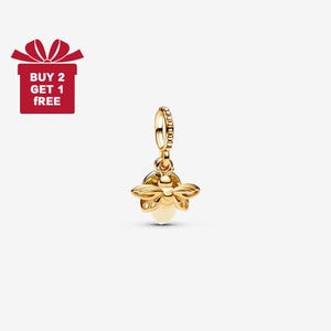May include: A gold-coloured bee charm with a cream-coloured body and detailed wings. The charm is suspended from a beaded loop. A red gift box with the text "BUY 2 GET 1 FREE" is in the upper left corner.