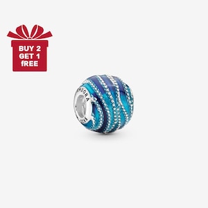 May include: A blue and silver bead with a swirling design. The bead has a silver core with the word "PANDORA" and "S925" engraved on it. The bead is decorated with blue enamel and small, white crystals.