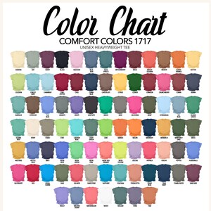 May include: Color chart featuring a variety of Comfort Colors 1717 unisex heavyweight tees. The chart displays a wide range of colors, including black, blossom, bay, and butter, with each color labeled for easy reference. The text "Color Chart" is at the top.