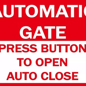 May include: A red and white sign with the text "AUTOMATIC GATE PRESS BUTTON TO OPEN AUTO CLOSE".