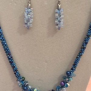 Blue beaded necklace and matching earrings
