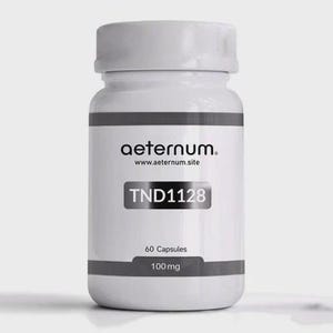May include: A white bottle with a white cap, labelled "aeternum" and "www.aeternum.site". The label also includes "TND1128", "60 Capsules", and "100 mg". The bottle has a grey band at the top and bottom.