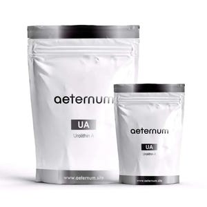 May include: Two white pouches with black tops and silver bottoms. The larger pouch has the word "aeternum" printed on it, with "UA Urolithin A" below. The website www.aeternum.site is printed at the bottom. A smaller pouch is next to it.