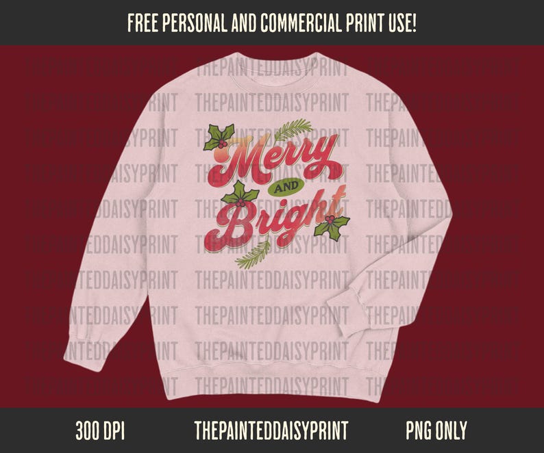 May include: A light pink sweatshirt with the words "Merry and Bright" in red script, accented with green holly and sprigs. The text is in a vintage style. The sweatshirt is a long-sleeved crew neck.