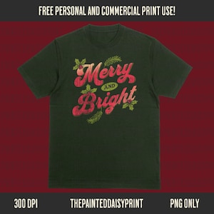 May include: Dark green t-shirt with the words "Merry and Bright" in red, stylized text. The design includes holly and pine sprigs. The top banner reads "FREE PERSONAL AND COMMERCIAL PRINT USE!" and the bottom banner reads "300 DPI THEPAINTEDDAISYPRINT PNG ONLY".