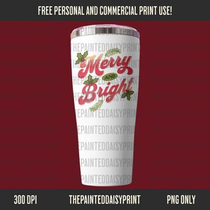 May include: A white stainless steel tumbler with a lid, featuring the text "Merry and Bright" in red and green, with holly and pine sprig accents. The tumbler has the text "THEPAINTEDDAISYPRINT" repeated vertically.