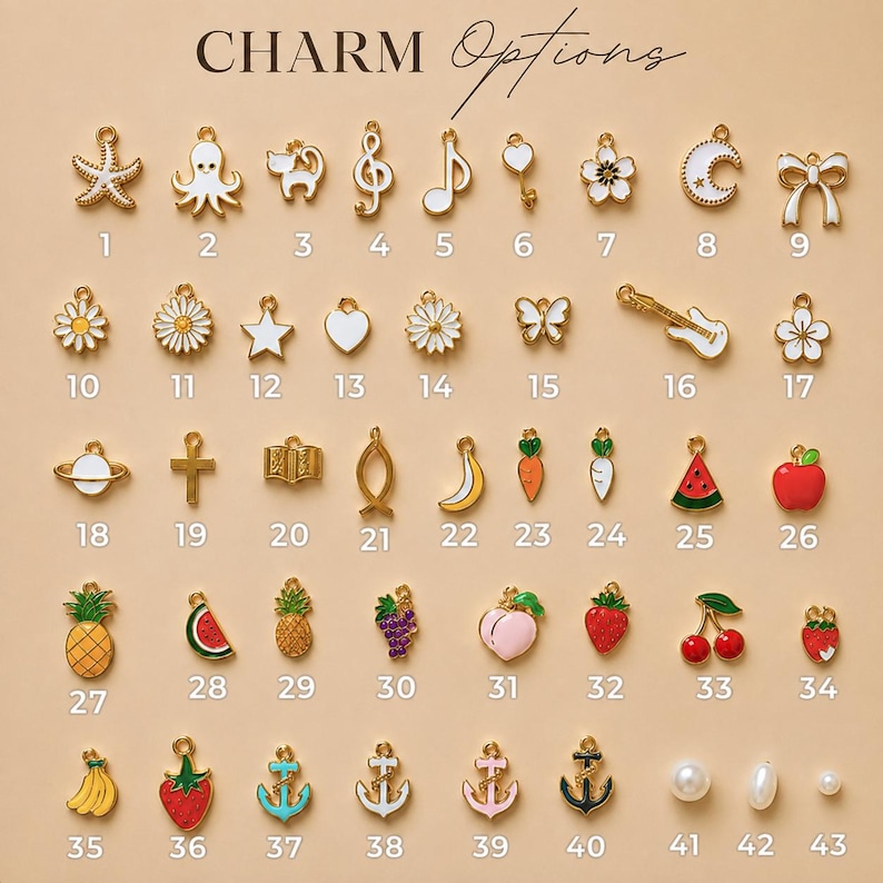 May include: A collection of forty-three small metal charms labeled with numbers, featuring various shapes including animals, fruits, musical notes, celestial bodies, and symbols, all arranged in a grid on a light tan background with the text CHARM Options.