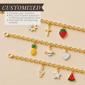 May include: Three gold-toned link chains featuring various enamel charms including a white daisy, a gold cross, a red strawberry, a yellow pineapple, a white planet, a white heart, a white treble clef, a white star, and a watermelon slice.