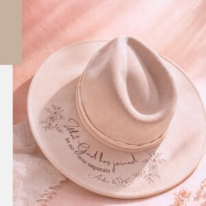 Puede incluir: Sombrero fedora beige claro con detalles florales y el texto "What God has joined, let no one separate". La imagen tambi&eacute;n incluye el texto "12 Western Wedding Ideas for the Boho Bride To Be".