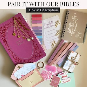 May include: A collection of religious accessories, including a pink Bible with a gold bookmark, highlighters, stickers, and a notebook. The image includes the text "PAIR IT WITH OUR BIBLES" and "Link in Description". The items are arranged on a white surface.