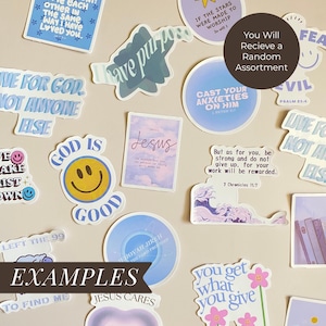 May include: A collection of assorted stickers with inspirational quotes and religious themes. The stickers feature various colors, fonts, and designs, including a smiley face, floral accents, and the text "Jesus". The stickers are arranged on a neutral background.