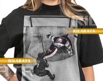 Camiseta vintage de Connor Hellebuyck con medalla de oro en hockey sobre hielo y un momento dorado, regalo para mujer y hombre, camiseta unisex, sudadera deportiva