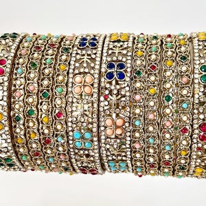 May include: A set of three ceramic mugs with a speckled, matte finish. The mugs are in shades of cream, light gray, and dark gray. Each mug has a simple, minimalist design, perfect for coffee or tea.