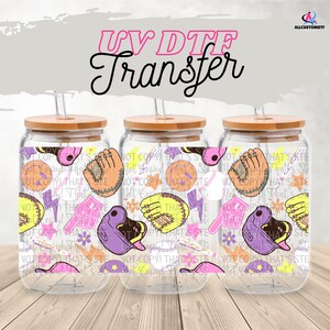 May include: Three clear glass beverage cups with bamboo lids and straws. Each cup has a baseball-themed design with gloves, baseballs, and lightning bolts. The text "UV DTF Transfer" is at the top.