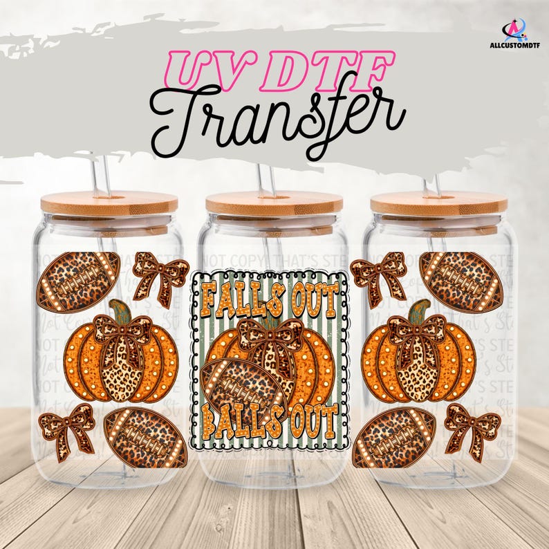 May include: Three glass tumblers with bamboo lids and straws. Each tumbler features a pumpkin and football design with leopard print accents. The text "FALLS OUT" is displayed on the center tumbler. The image is labeled "UV DTF Transfer".