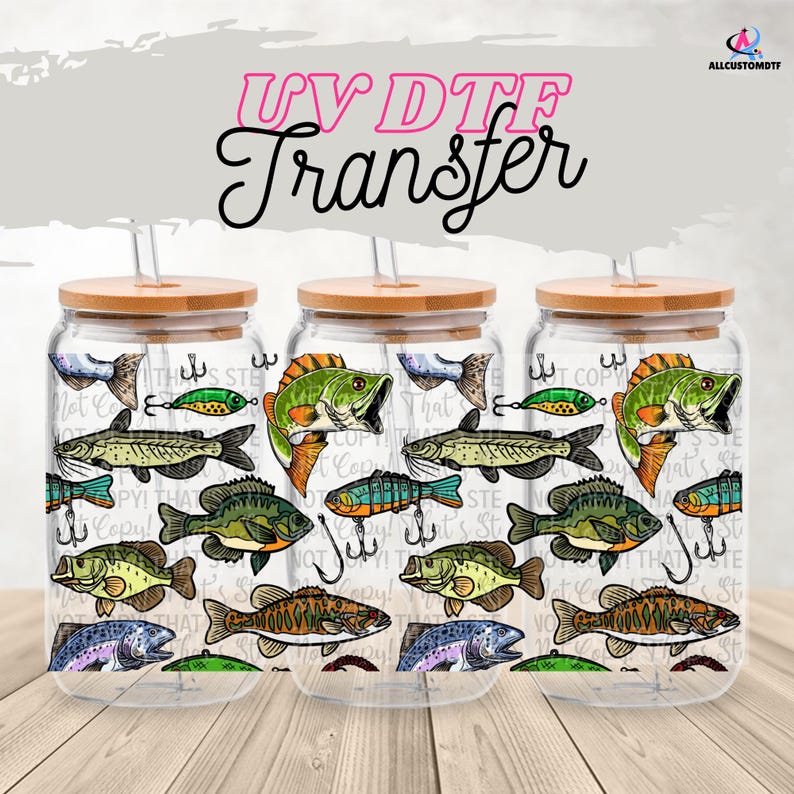 May include: Three clear glass drinking jars with bamboo lids and straws. The jars are decorated with a repeating pattern of various fish illustrations, fishing lures, and hooks. The text "UV DTF Transfer" is at the top.