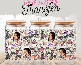 May include: Three clear glass jars with bamboo lids and straws. Each jar has a colorful design featuring a woman's face, the words "The Craft", "Bonnie", and various occult symbols.