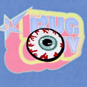 Red and White Tufted Evil Eye Rug