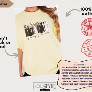 May include: A light yellow t-shirt with a graphic of several figures and the text "pray for us." The shirt is made of 100% US cotton and features the text "Won't Crack or Peel." The shirt is from Hollstyle Urban Shop.