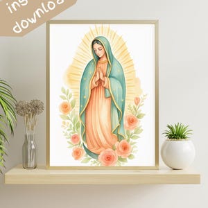 May include: Watercolor print of a religious figure in a teal cloak and peach dress, surrounded by roses and greenery. The image is framed in gold and has the words "instant download" in the upper left corner.