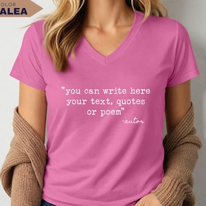 May include: A short-sleeved azalea pink V-neck t-shirt featuring white typewriter-style text on the chest that reads: "you can write here your text, quotes or poem" followed by the signature "-autor" in a cursive script font.
