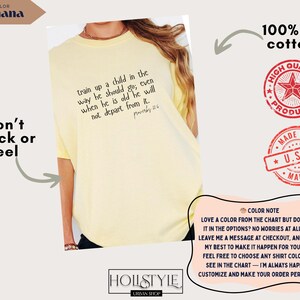 May include: A light yellow t-shirt with the text "train up a child in the way he should go; even when he is old he will not depart from it." The shirt is made of 100% US cotton and features a "High Quality Products" and "Made in U.S.A." stamp.