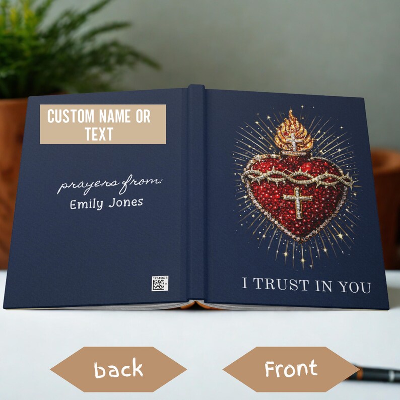 May include: A navy blue book with gold accents. The front cover features a detailed illustration of a heart with a crown of thorns and a cross. The text "I TRUST IN YOU" is below the heart. The back cover has the text "CUSTOM NAME OR TEXT" and "prayers from: Emily Jones."