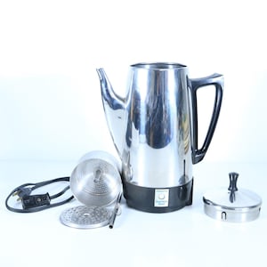 May include: A stainless steel Presto electric percolator coffee maker with a black handle and base. The set includes the main carafe, a metal filter basket, a circular metal lid with a black knob, and a detachable black power cord.