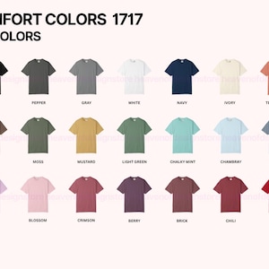Może przedstawiać: Prezentacja koszulek Comfort Colors 1717 w r&oacute;żnych kolorach, w tym czarnym, białym i granatowym. Obraz przedstawia gamę odcieni, od neutralnych ton&oacute;w po żywe odcienie, z każdą koszulką starannie zaprezentowaną.