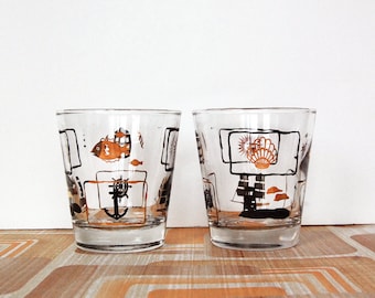 Vintage MidCentury Modern Pair of Nautical Theme Lowball Cocktail Drinking Glasses with Gold and Black Sun and Sea Summer Design.
