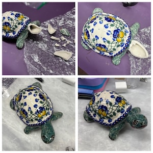 May include: A ceramic turtle figurine with a broken shell, showcasing a floral pattern in blue, yellow, and green. The turtle's body is green with white speckles. The shell is decorated with blue and yellow flowers.