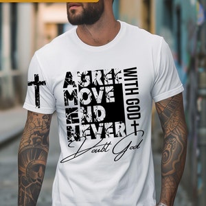 May include: A white t-shirt with a black graphic design that reads "A Great Move End Never Doubt God" with a cross symbol. The graphic design is in a distressed style.