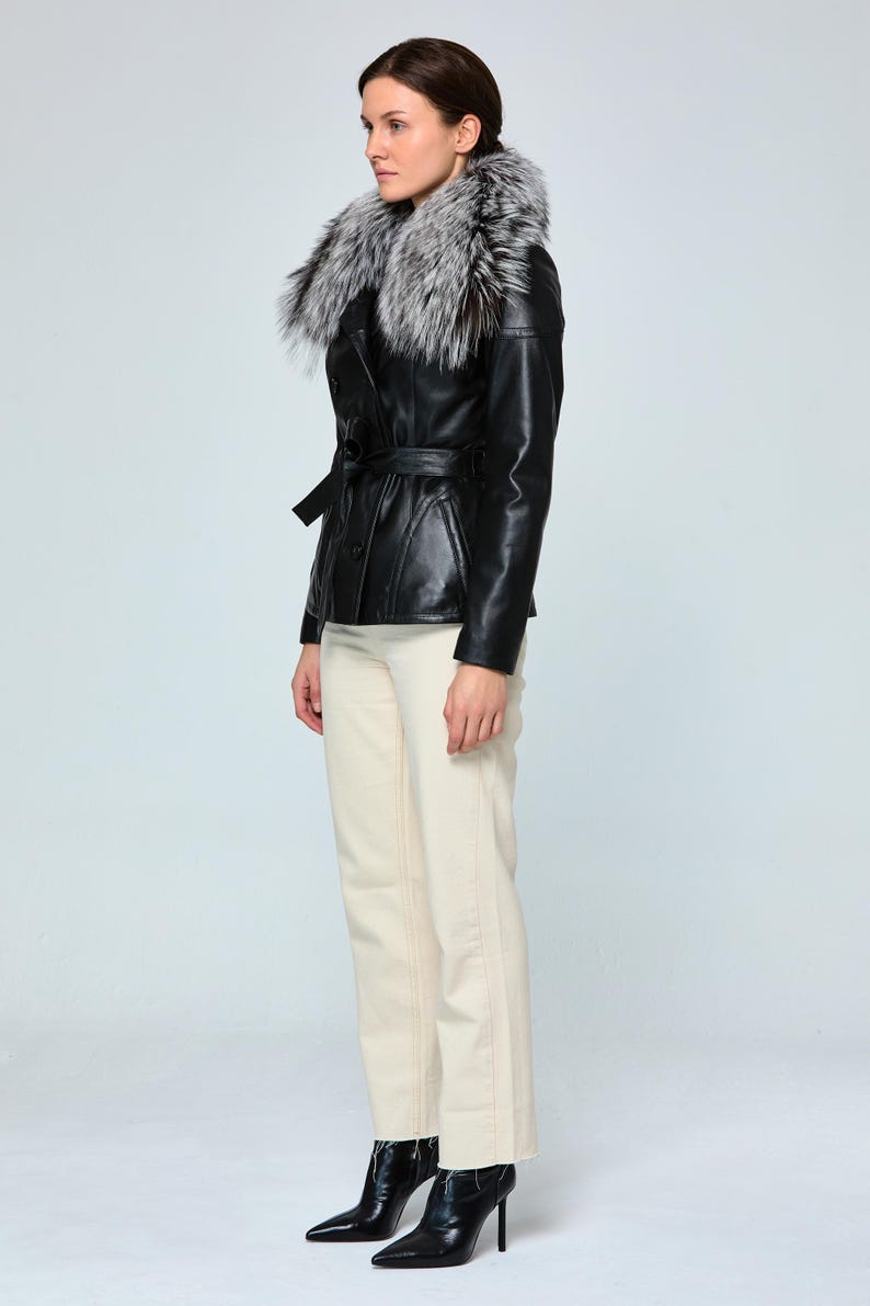 Women’s black leather coat with elegant fox fur collar and slim fit silhouette


Luxury Turkish lambskin peacoat jacket designed for sophisticated winter style


Handmade black genuine leather trench coat with detachable fur collar


Women’s slim fit winter leather coat crafted from premium Turkish lambskin