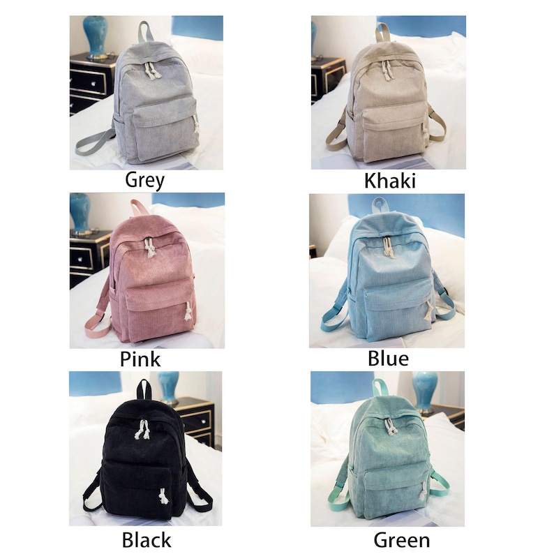 May include: A collection of corduroy backpacks in various colors: grey, khaki, pink, blue, black, and green. Each backpack has a front pocket, adjustable straps, and a top handle. The image displays the backpacks on a bed.