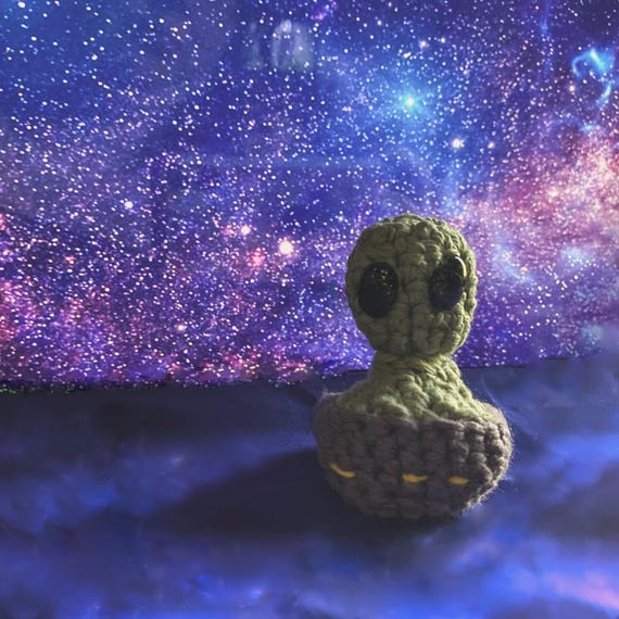 A handmade crochet alien fidget toy that's quirky, tactile, and genuinely one-of-a-kind — the kind of weird little desk companion that sparks instant curiosity.
