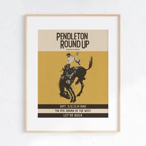 May include: Framed vintage poster for the Pendleton Round Up rodeo event. The poster features a silhouette of a cowboy riding a bucking bronco against a mustard yellow background. Text includes "PENDLETON ROUND UP" and event details.