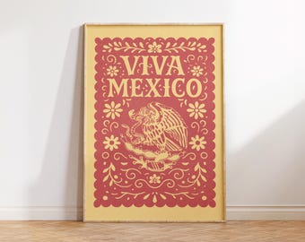 May include: A framed poster with a yellow background and red decorative elements. The text "VIVA MEXICO" is displayed at the top. The center features an eagle emblem. Floral and scroll designs frame the text and emblem.
