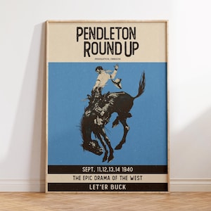 May include: Vintage poster for the Pendleton Round Up rodeo event. The poster features a cowboy riding a bucking bronco against a blue background. Text includes "Pendleton Round Up," event dates, and "Let'er Buck."