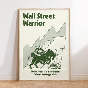 May include: A framed poster with the words "Wall Street Warrior" in green. The image shows a person riding a bull, with arrows pointing upwards, and the text "The Market is a Battlefield Where Strategy Wins."