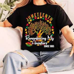 May include: A black t-shirt featuring a colourful tree graphic and the text "Juneteenth Remembering My Ancestors Since 1865".
